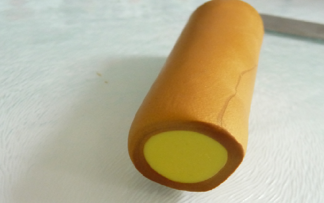 Yellow and gold clay cylinder