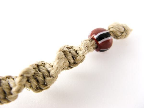 Bead on end of a hemp bracelet